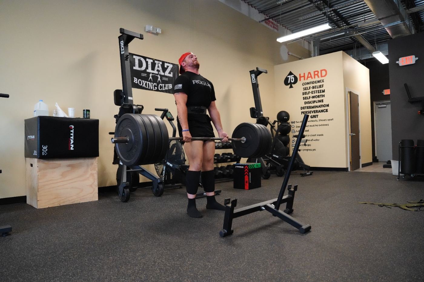 Member locking out a heavy deadlift at Elevate Barbell Club in Newberry FL