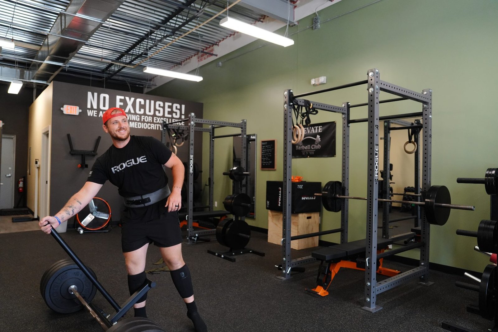 Squat racks, platforms, and barbells inside Elevate Barbell Club in Newberry FL